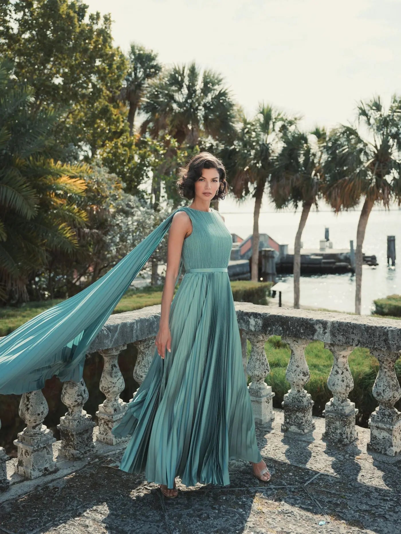 Green Sleeveless High Neck Cape Back Heat Pleated Gown